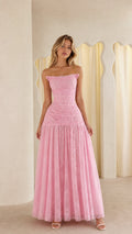 Front view of model wearing pink ruched strapless lace maxi dress