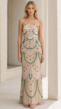 Front view of model wearing the champagne beaded strapless evening gown