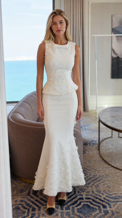 Front view of white 3D floral peplum mermaid maxi dress