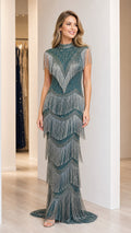 Front view of model wearing emerald green beaded fringe high neck evening gown
