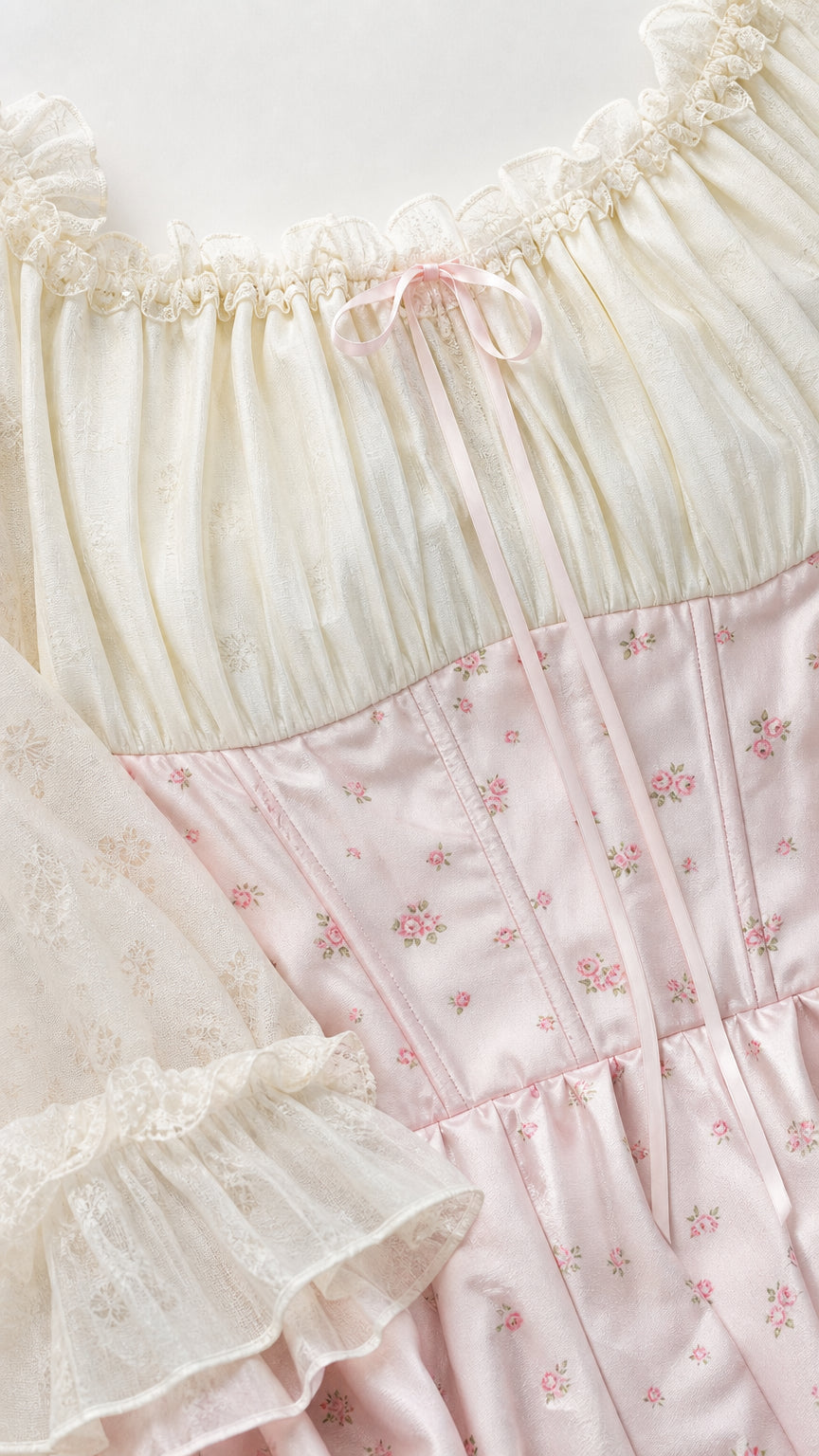 Close-up detail of neckline, bodice, and sleeves of pink dress